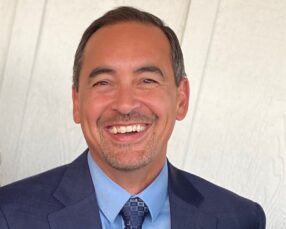 Headshot photo of Kevin May